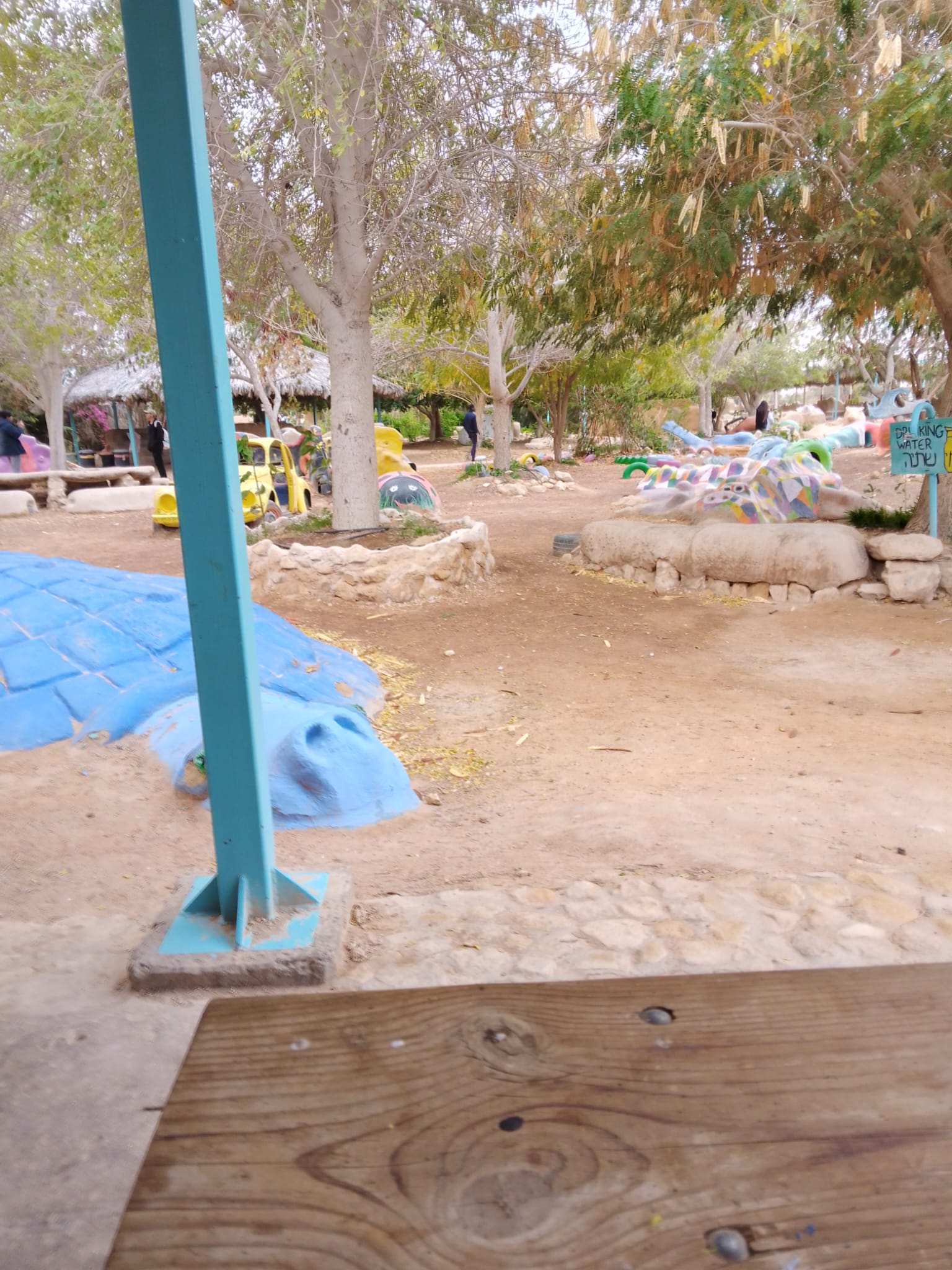 Community play and gathering space with a drinking water sign
